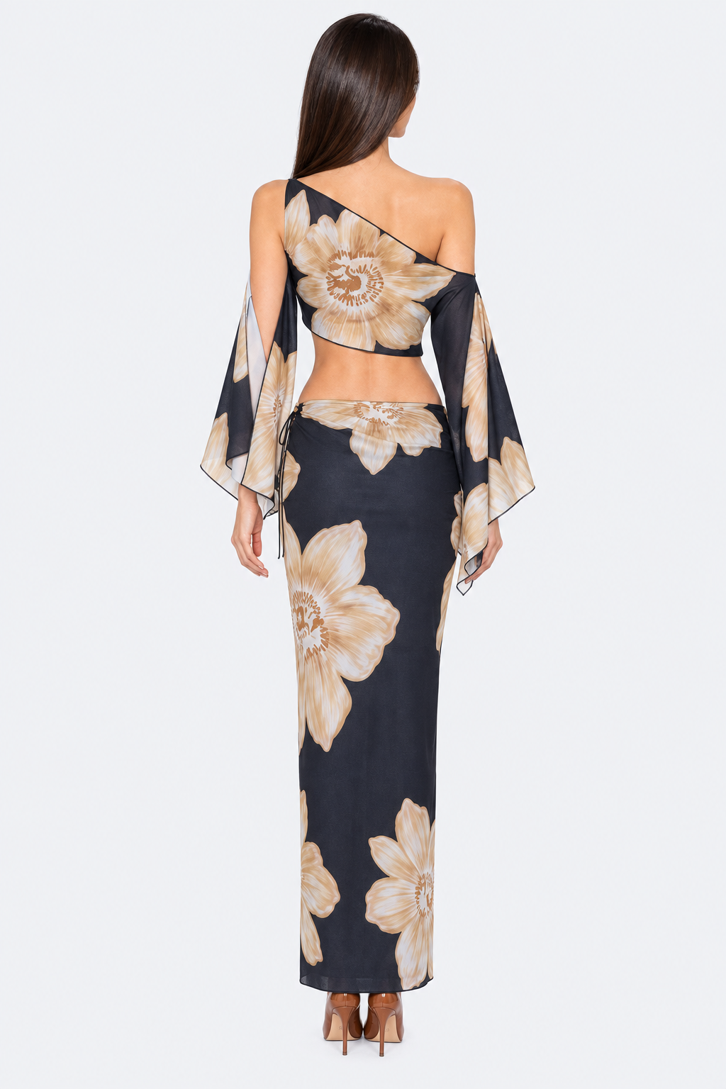 Black and beige floral skirt set with asymmetric crop top, back view