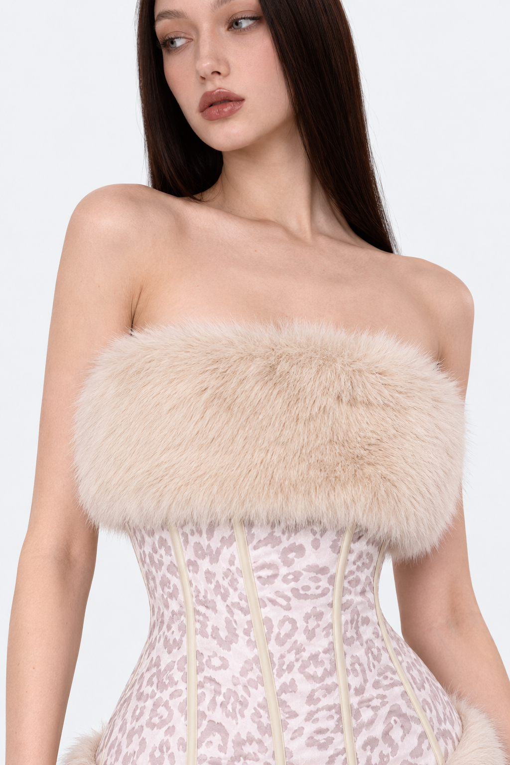Blush leopard-print strapless mini dress — strapless neckline and plush trim close-up