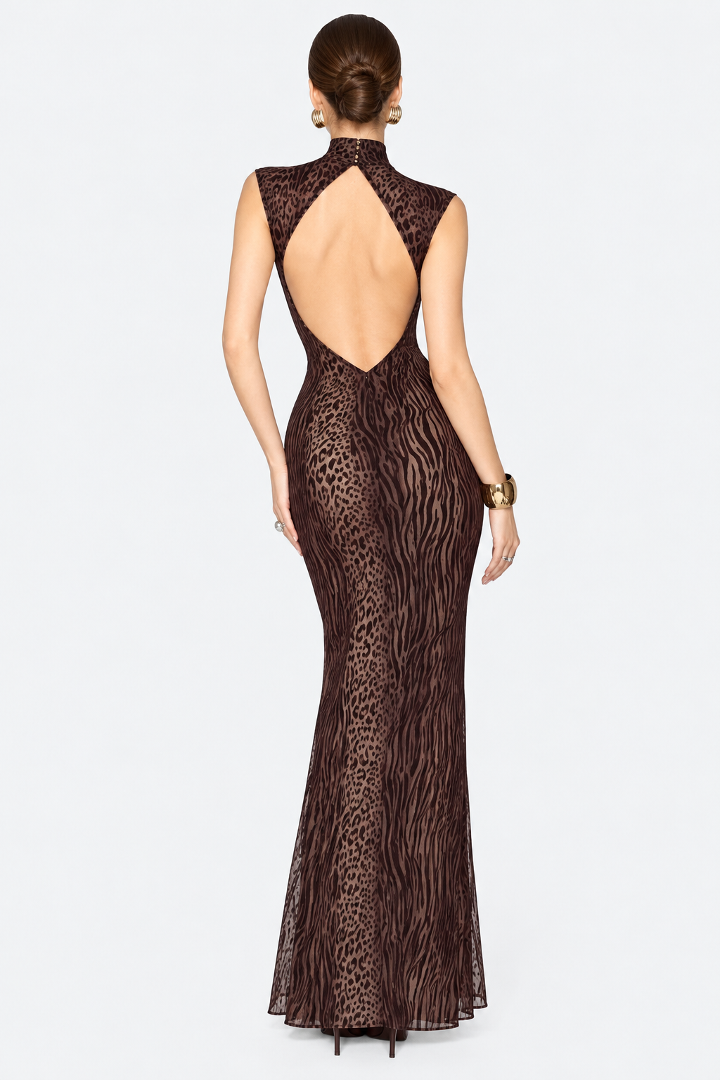 Back view of the brown animal-print maxi dress showing the large back cutout.