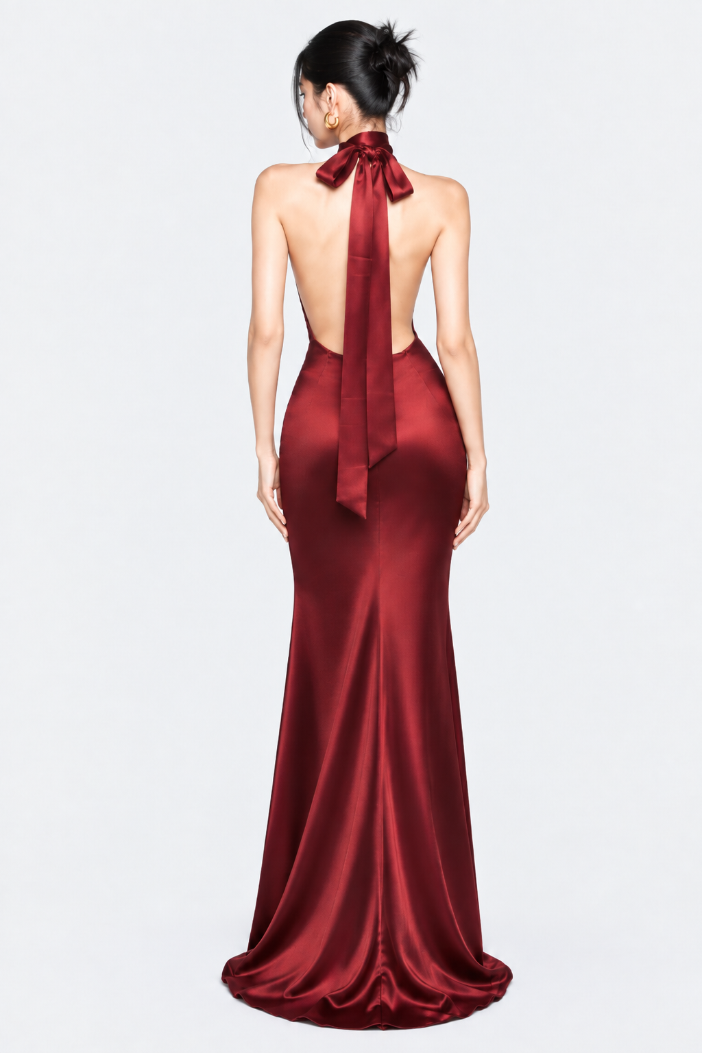 Open back and long satin neck ties on the burgundy halter maxi dress