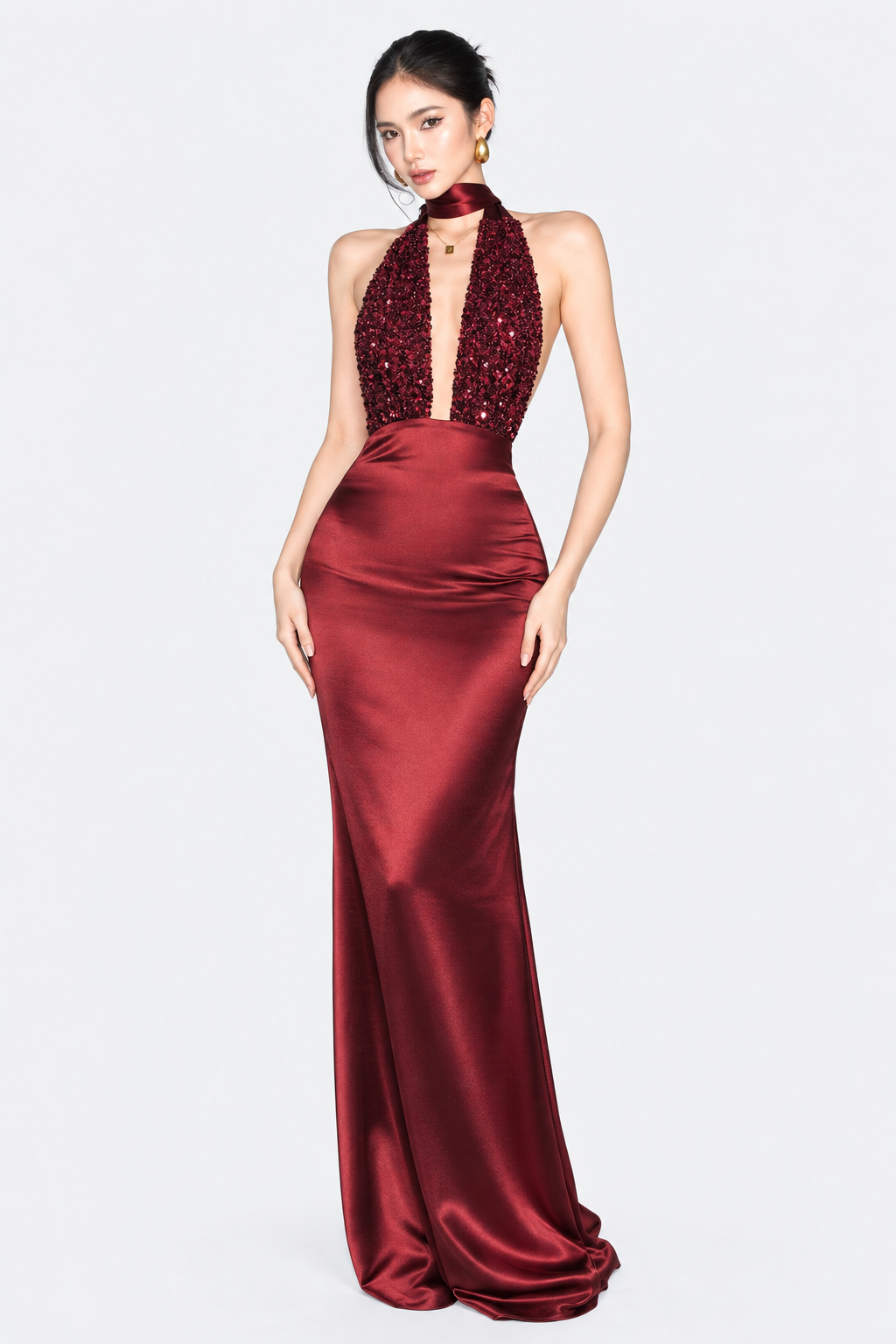 Burgundy halter maxi dress with a plunging sequinned bodice, front view