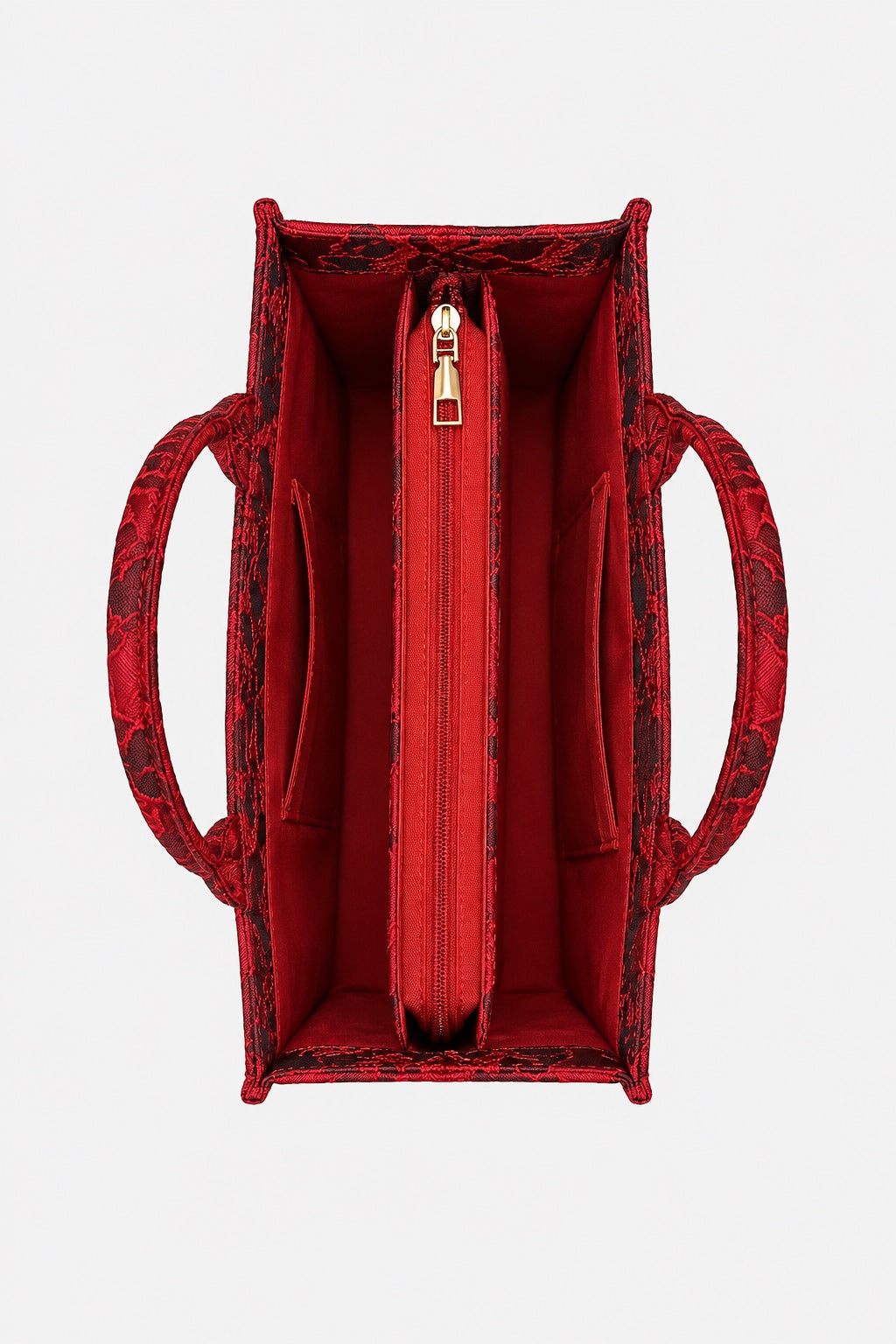 Red textured tote bag with a matching red interior, featuring a central zippered pocket and side handles, shown from a top-down view on a light gray background.