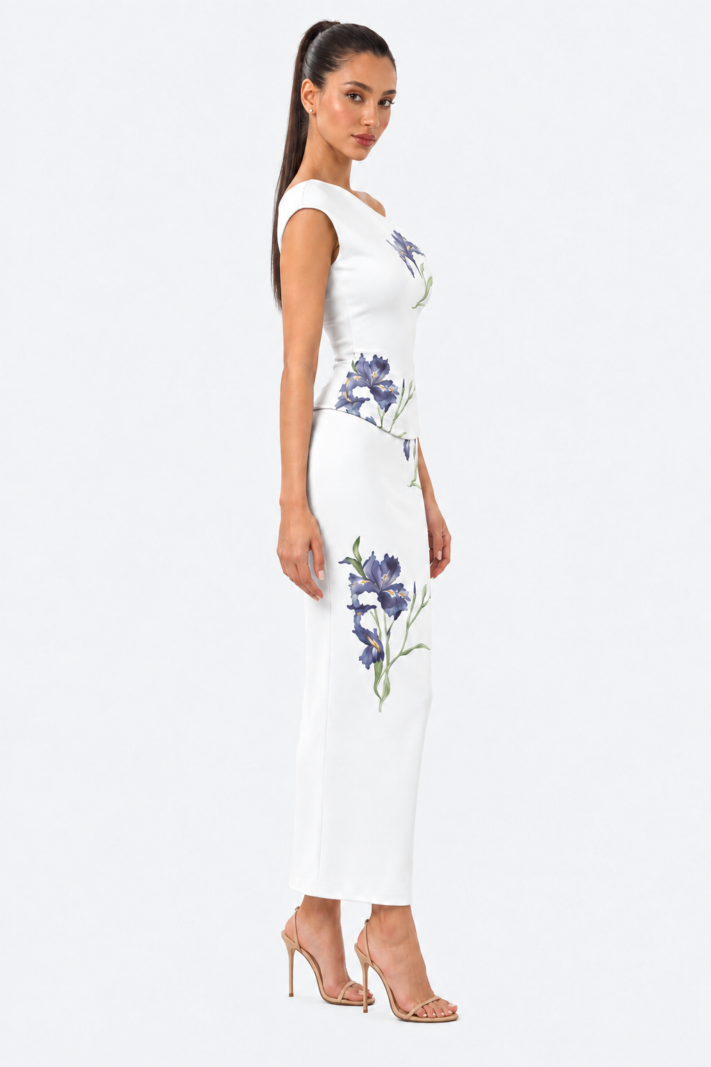 White floral top and skirt set with a fitted silhouette and blue iris print, side view